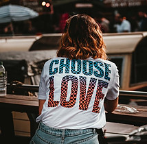 woman with choose love on the back of her shirt