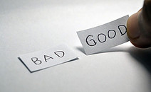'bad' and 'good' written on paper